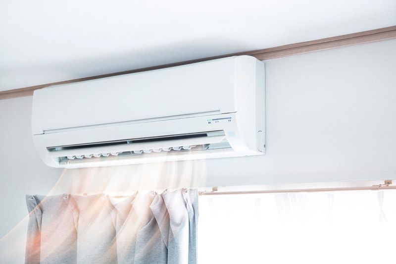 Planning to Remodel? Go Ductless! Image shows ductless mini split in home.